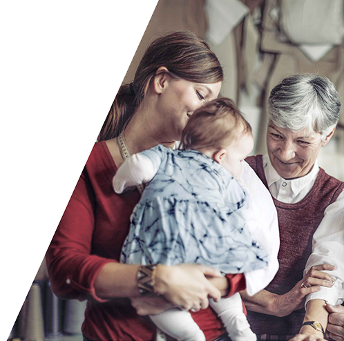 mom, baby and grandma smiling